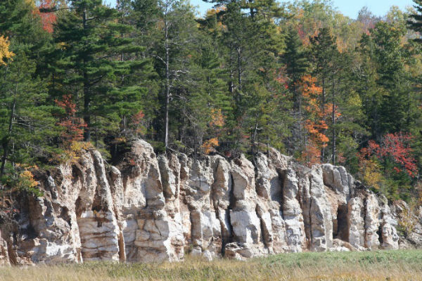 Gypsum cliffs at Sweets Corner, near Windsor, NS. Such thick evaporite deposits in the Maritimes are compelling evidence that a large part of the region crossed the tropics around 350 million years ago. Photo – Dr. Rob Fensome