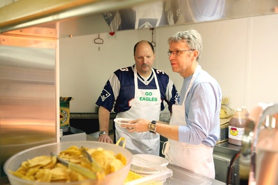 Senior officers and science staff serving in the mess at 