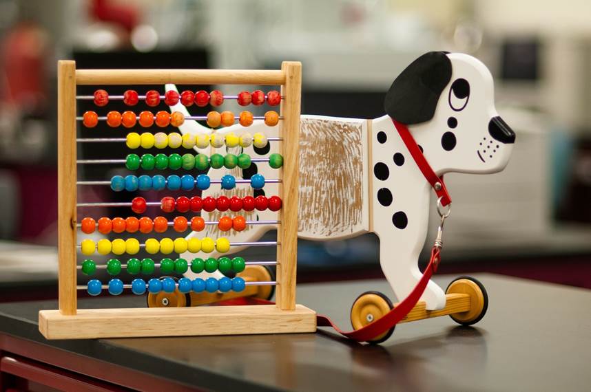 This dog and abacus have had their paint scraped off, to be tested in our chemistry lab.  Toys that have a surface coating (e.g., paint) containing unsafe amounts of lead, antimony, arsenic, cadmium, selenium, barium or mercury are not permitted. These chemicals in paint can poison children if they are eaten.