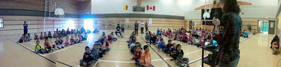Emilie addressing captivated Kugluktuk elementary students
