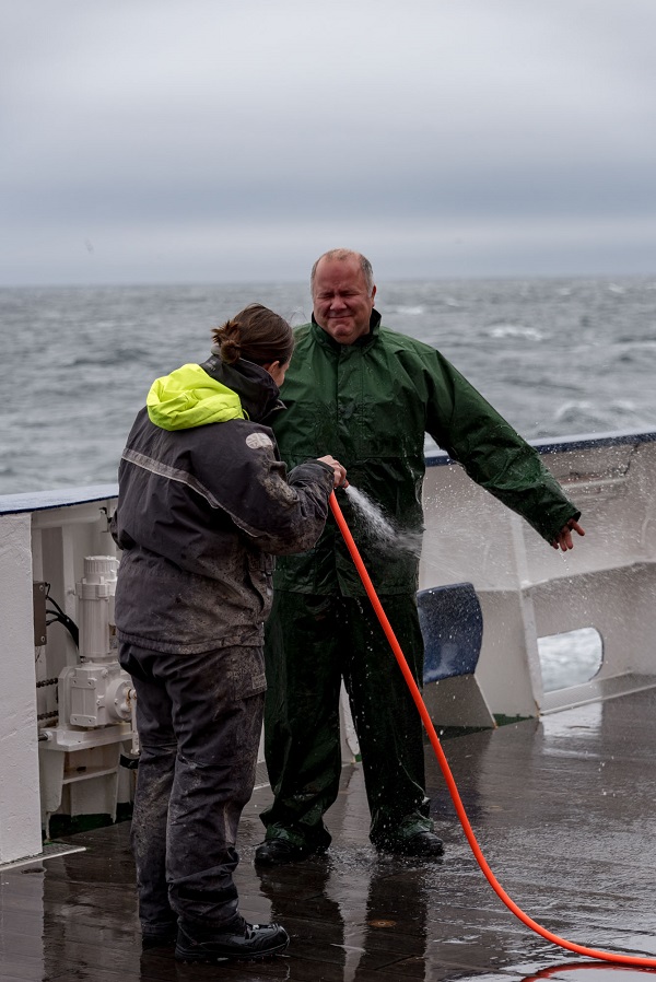 Dr. Calvin Campbell getting hosed off at the end of the cruise