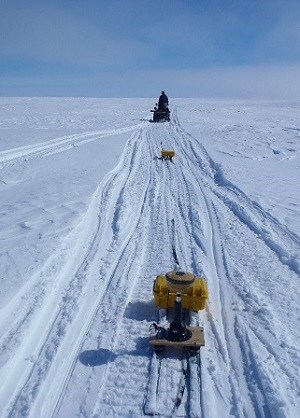 Anna and Jaypootie Moesesie collecting a thickness profile with ice penetrating radar in May 2016. This ice island, “PII-A-1-f”, was located close to Qikiqtarjuaq, Nunavut. 