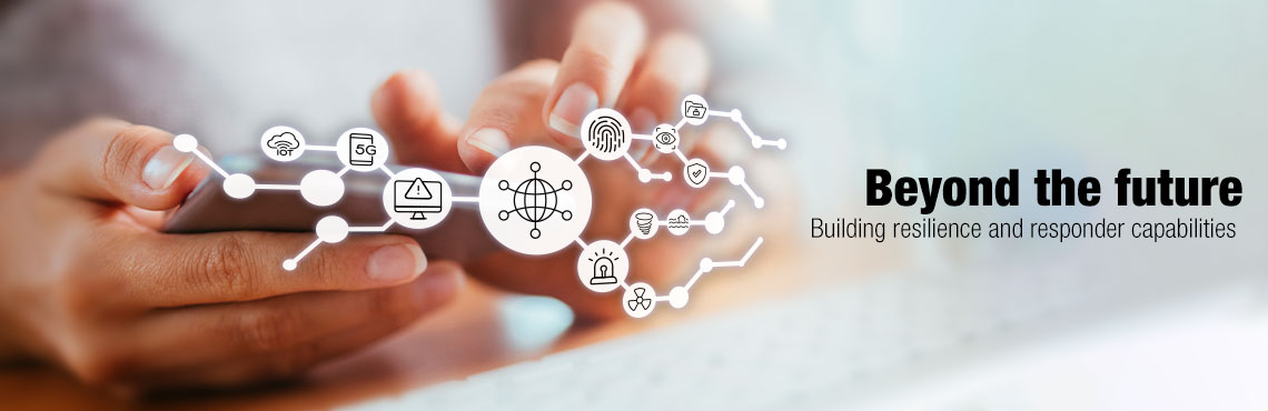 Hand holding a cell phone with icons representing technology floating above. Text on image: Beyond the future: Building resilience and responder capabilities.